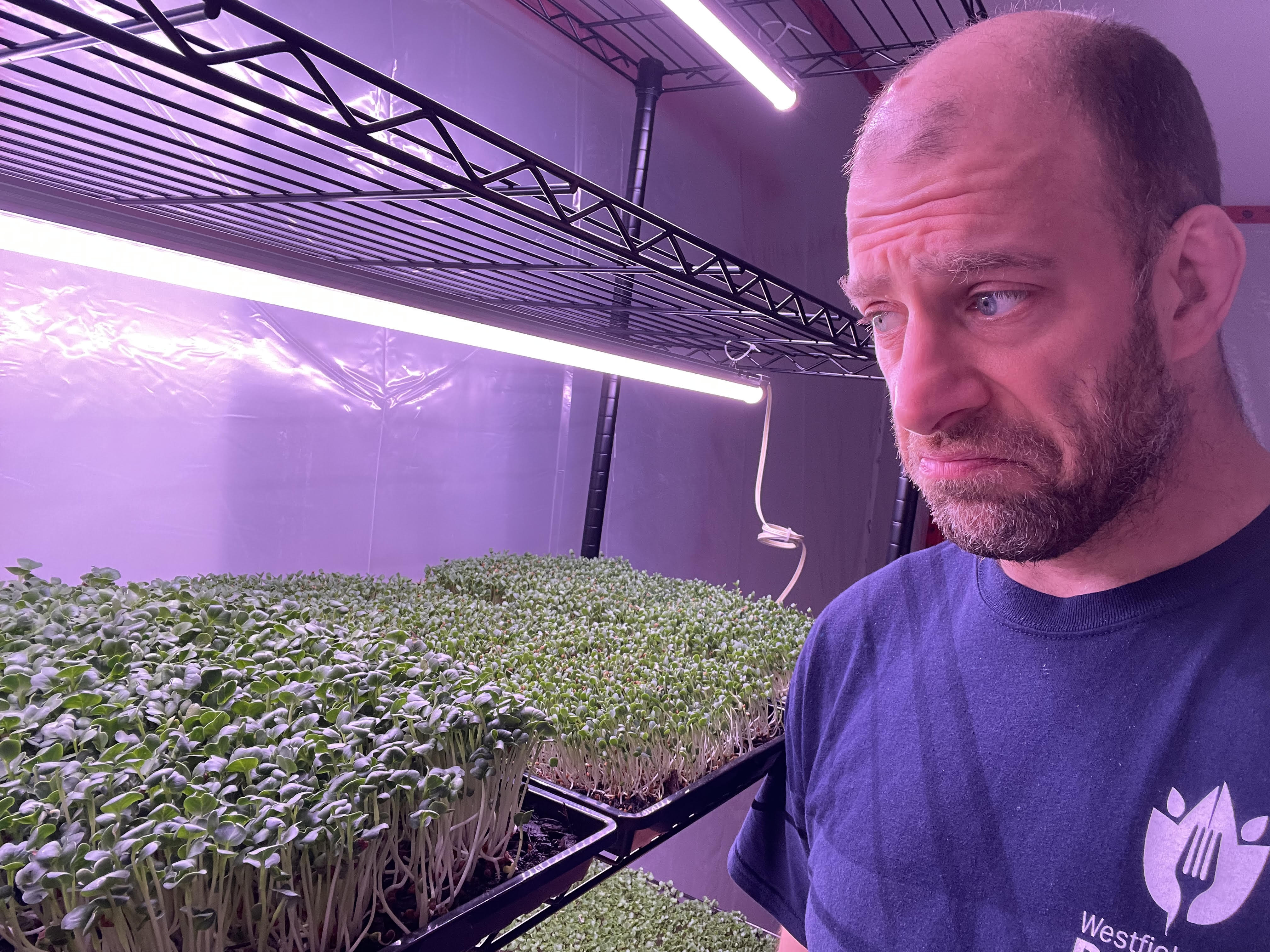 Eric in a microgreens grow room.